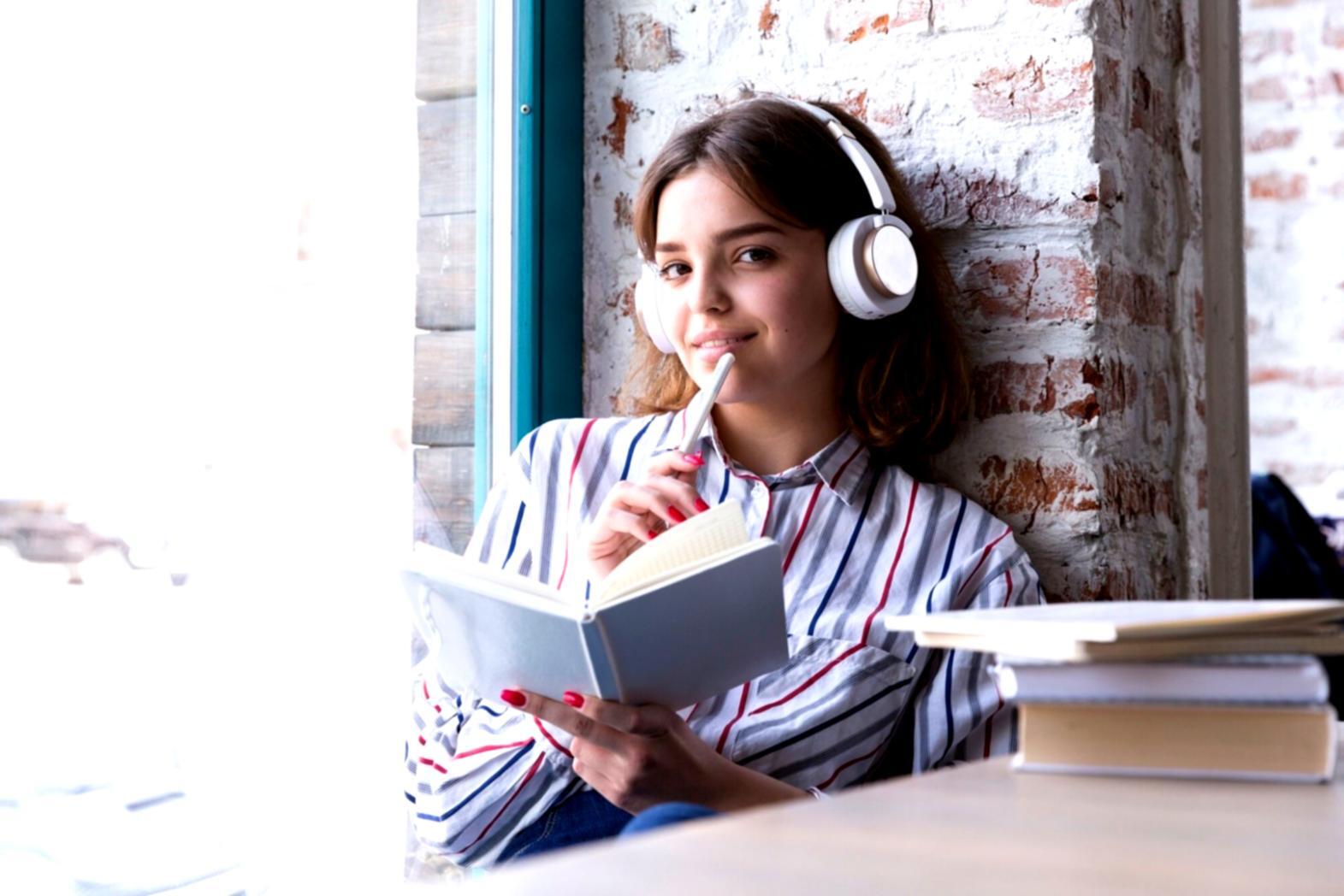 Student reviewing weekly budget planning materials and financial documents